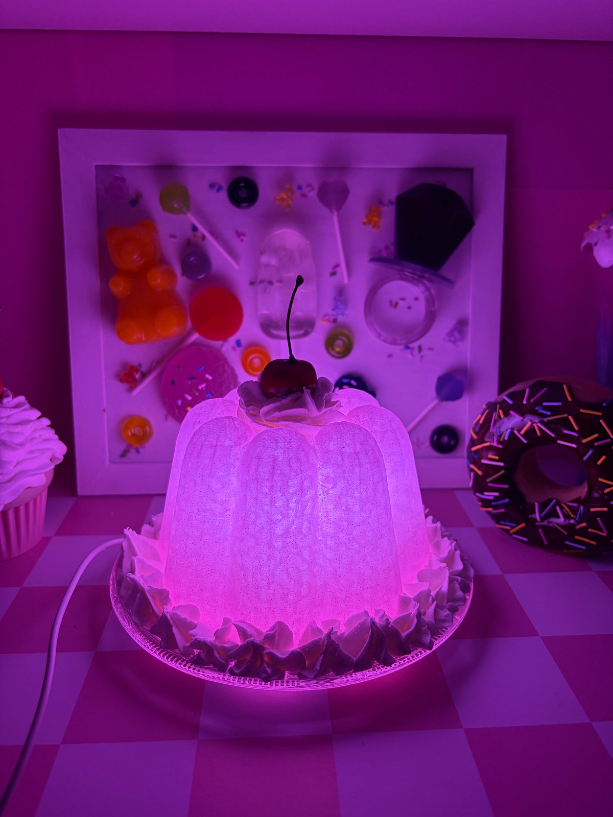 Glowing pink dopamine-decor night light on a candy-shop shelf